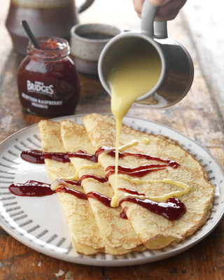 Crepes with Raspberry Preserve and Warm White Chocolate Sauce