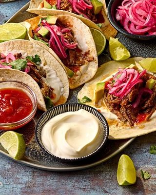 Slow Cooker Beef Brisket Tacos with Pink Pickled Onions 